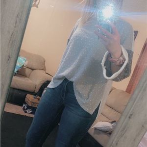 This is a grey/white sweater, it is very comfy and warm. Pairs good with jeans.